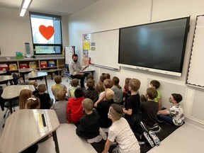 Principal Bill Schlacht reads to students at Heritage Hills Elementary.