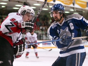 Zack Stortini hooks up Jamie McGinn late in third-period action as the The Ottawa 67’s face the Sudbury Wolves at the Ottawa Civic Centre in 2005.