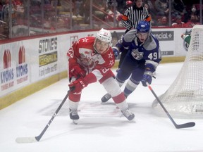 Soo Greyhounds forward Rory Kerins chases down the puck while Sudbury Wolves defenceman Payton Robinson follows from behind. The Wolves scored three consecutive goals to snap a 3-3 tie, en route to a 6-3 win over the Greyhounds in Ontario Hockey League action at the GFL Memorial Gardens on Saturday night.