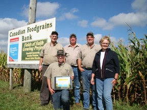 At a roadside celebration on October 6, the Hill Family were recognized for their 30 years as a growing partner with the Canadian Foodgrains Bank. The project is located on Mill Road, between Varna and Bayfield on land owned by Hill and Hill Farms. The land was originally offered by the late Gordon Hill for the project, and succeeding generations of the family continue the tradition of service. Today, Gordon’s son and daughter-in-law, Bev and Shirley Hill, his grandsons Paul and Jim and his great grandson Luke Hill are all involved in the project. SUBMITTED