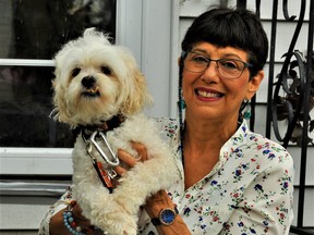 Pam Chiotti, owner of Hello Doggy! Dog Grooming and Dog Sitting in Port Dover, is among hundreds of residents in the lakeside community who have expressed interest in the establishment of a dog park by the lakeside. With Chiotti is her personal pet Oggy. – Monte Sonnenberg