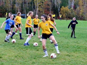 Amanda Cuthbert, foreground, practises with teammates from the Laurentian Voyageurs women's soccer team at Laurentian University in Sudbury, Ontario on Tuesday, October 12, 2021.