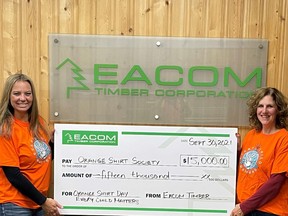 Monique Koski (L) mill manager at EACOM Timmins mill and Jennifer Tallman, chief forester for EACOM Ontario, present the $15,000 donation to Orange Shirt Society on the occasion of National Day for Truth and Reconciliation, on Sept. 30.