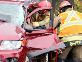 Firefighters respond to a two-vehicle collision on Trunk Road near a service station on Wednesday, Oct. 13, 2021 in Sault Ste. Marie, Ont. (BRIAN KELLY/THE SAULT STAR/POSTMEDIA NETWORK)