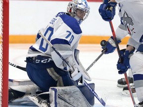 Mitchell Weeks (70) of the Sudbury Wolves keeps his eye on the puck during OHL pre-season action against the Ottawa 67's at Sudbury Community Arena on Sunday, October 3, 2021.
