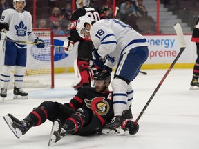 Ottawa Senators left winger Austin Watson (16) collides with Toronto Maple Leafs center Michael Amadio (18) in the first period at the Canadian Tire Centre. Marc DesRosiers-USA TODAY Sports