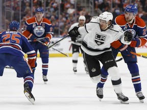 Los Angeles Kings forward Jordan Nolan (71) battles Darnell Nurse (25) and Leon Draisaitl (29) during the first period of a NHL game between the Edmonton Oilers and the LA Kings at Rogers Place in Edmonton on Tuesday, March 28, 2017.