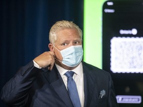 Ontario Premier Doug Ford announces the province's new vaccine certificate at a news conference at Queens Park in Toronto on Friday, Oct. 15, 2021. The certificate comes in the form of QR code that businesses can scan with an app they download. (THE CANADIAN PRESS/Chris Young)