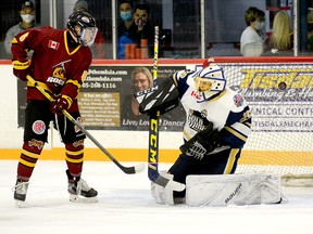 Timmins Rock forward Tyler Patterson watches as teammate Cameron Dutkiewicz’s point shot finds the back of the net behind Kirkland Lake goalie Glen Crandall during the first period of Sunday afternoon’s NOJHL contest at the McIntyre Arena. Dutkiewicz’s third goal of the season, a power-play marker, stood up to be the game-winner as the Rock went on to dump the Gold Miners 4-1. THOMAS PERRY/THE DAILY PRESS