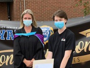 Katie Hill was the first Saugeen District Senior School Class of 2021 graduate to receive her diploma, from guidance counsellor Alyssa Dunlop, at a drive-through Commencement ceremony Oct. 8 at the Port Elgin school. [Frances Learment]