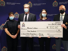 This year’s recipient of the Karrie Burke Young Women in Policing Bursary is Marina Leblanc, seen here accepting a cheque from GSPS Chief Paul Pedersen and Darrell Burke, husband of the late Karrie Burke.