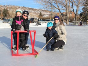 Emma, Mats, Nathan and Lauren enjoy a warm afternoon on the new downtown skating rink February 20. Patrick Gibson/Cochrane Times