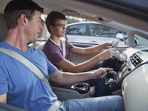 A Teenager with his driving instructor. (Metro Creative Services)