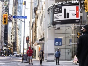 An electronic billboard from Fairness Alberta, at the corner of Yonge and Richmond Streets in downtown Toronto. Ernest Doroszuk/Postmedia