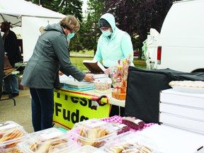 Dawn Galloway sells pies and other baked treats from her Sweet Shoppe booth at the Leduc Farmers Market Sept. 30. Galloway is president of the Leduc Farmers Market AssociationÕs board of directors. (Ted Murphy)