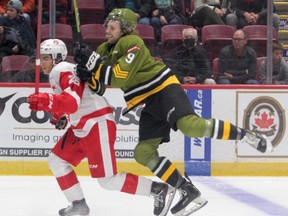 Soo Greyhounds forward Marco Mignosa collides with North Bay Battalion winger Josh Currie during Ontario Hockey League action at the GFL Memorial Gardens on Friday night. After winning 8-5 over the Battalion on Friday night, the Greyhounds drop a 4-2 decision to the Battalion 24 hours later at the downtown rink.