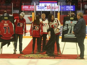 Number 71 is officially retired. The parents of Noah Dugas, Dave and Jody Dugas, and Noah’s sister, Jorja, unveil two framed jerseys Saturday at Memorial Gardens. The jerseys from the North Bay Minor Hockey Association and North Bay and District Trappers Hockey Association will be put on display inside Memorial Gardens Arena.