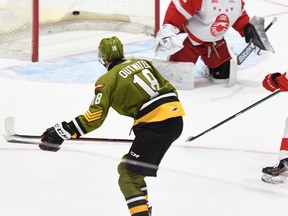 Owen Outwater of the visiting North Bay Battalion beats goaltender Charlie Schenkel of the Sault Ste. Marie Greyhounds in the first period of the teams' Ontario Hockey League game Saturday night. It was the first goal of the season for Outwater, the Troops' first-round pick in the OHL Priority Selection in June.