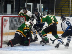 Winterhawks forwards Justin Donnelly (right) and Lauchlin Elder battled for a loose puck in the Seaforth crease during the second period at The Plex Oct. 16. Seaforth edged the ‘Hawks 3-2 in a shootout.