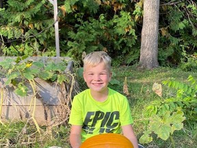 Will Anderson is proud of his large pumpkin. It looks like his was the heaviest in the club this year.