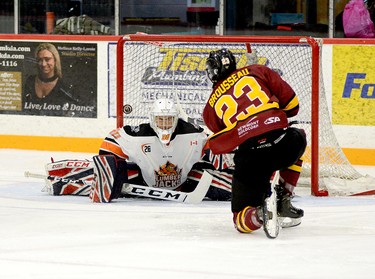 Timmins Rock forward Riley Brousseau goes down to one knee as he lifts the puck up an over Hearst Lumberjacks goalie Matteo Gennaro during the first period of Friday night’s NOJHL contest at the McIntyre Arena. Brousseau finished the contest with two goals as the Rock held on to edge the Lumberjacks 4-3. The Rock will return to action on Friday when they host the Cochrane Crunch at the McIntyre Arena, at 7:30 p.m. THOMAS PERRY/THE DAILY PRESS