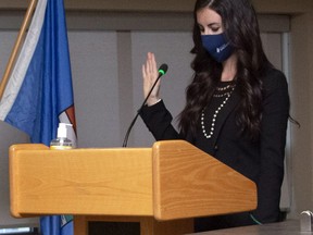 Spruce Grove's new council, including Mayor Jeff Acker, were sworn-in during a special ceremony in the council chambers on Oct. 25. New city councillor Danielle Carter, right, is seen here reciting the oath as she is sworn in.