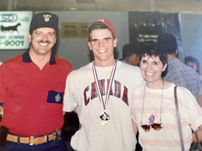 Mark Fraser with his parents, Marcel and Denise, at the World Youth Baseball Championship in Brandon, Man. in 1991.
