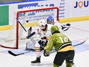 Dalyn Wakely opens the scoring for the North Bay Battalion in their Ontario Hockey League game Saturday night as Barrie Colts goaltender Matteo Lalama and Brandt Clarke fail to foil the Troops' rookie. The Battalion played the first of six straight road games.
Sean Ryan Photo