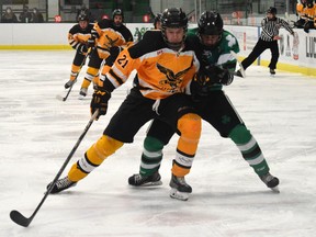 Connor Aarts and Cole Hislop battle for the puck in the Oct. 23 game in Lucan.