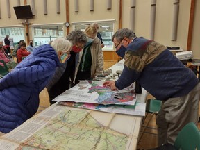 HFFN guest speaker Bob Geddes (R) points out the local bedrock and explains different rock layers and formations to Lois Hunter, Bo Jurkiewicz and Jackie Clements prior to Wednesday’s meeting. SUBMITTED