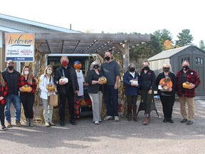 Winners of the 2021 Petawawa Ramble Pumpkin Folks business displays, posing with their trophies are, from left, Gloria Neville from the St. John's Lutheran Church; Gracie, Terry and Samantha Waito from Waito Homes; Anne Smith from Music for Young Children; Pastor Albert Romkema from St. John’s Lutheran Church; Linda and Ron Ticknor from the Petawawa Heritage Society; Tina McNish and Jillian McLellan from End of the Leash; Cheryl Jordan from the Country Cupboard; and William Grandy from the Shed. Missing from the photo are Vikas and Rupali Sharma, owners of Bright Eyes and Bushy Tails. Submitted photo