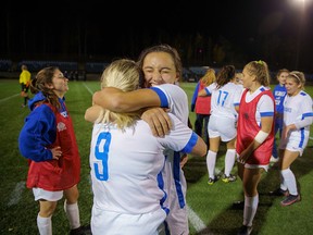 Huskies Isabela Bustos-Chaba (right) and Nathalie Andersson celebrate winning the first playoff game for Keyano's women's soccer team at Shell Place on Friday, October 15, 2021. Robert Murray/ Keyano Huskies