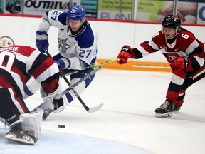 Quentin Musty of the Sudbury Wolves, tries to get the puck past goalie Collin MacKenzie of the  Ottawa 67’s at the Sudbury Community Arena on Sunday afternoon.