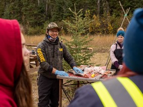 Justin Bourque, CEO of Willow Lake Métis, teaches students at a land-based learning camp. Photo supplied by Justin Bourque and taken by Nicholas Vardy Photography
