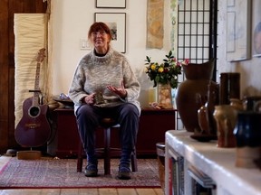 Bibi Clement, trained in the Japanese tradition of ceramics, relaxes in her Peace Country home surrounded by some of the pottery fired in her Anagama kiln. Her exhibition and sale, in partnership with Lane Borstad, opens at BACS on October 31.