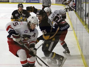 Brooks Bandits defenceman Brandon Scanlin beats Spruce Grove Saints defenceman Cory Babichuk to a loose puck during Game 4 of the AJHL final in 2019. Josh Thomas/Reporter/Examiner