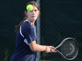 Lindsay St. Germain of Chatham-Kent hits a return during the mixed doubles final at the LKSSAA South tennis tournament at the Chatham Tennis Club in Chatham, Ont., on Tuesday, Oct. 12, 2021. Mark Malone/Chatham Daily News/Postmedia Network