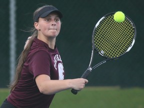 Kaitlyn Sammon of McGregor hits a return during the mixed doubles final at the LKSSAA South tennis tournament at the Chatham Tennis Club in Chatham, Ont., on Tuesday, Oct. 12, 2021. Mark Malone/Chatham Daily News/Postmedia Network