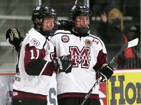 Chatham Maroons' Dylan Glinski, left, celebrates with Isaac LeGood after scoring his third goal against the St. Marys Lincolns in the third period at Chatham Memorial Arena in Chatham, Ont., on Sunday, Oct. 17, 2021. Mark Malone/Chatham Daily News/Postmedia Network