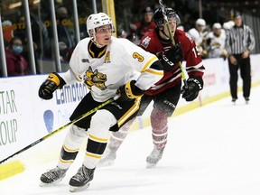 Sarnia Sting alternate captain Ryan Mast, left, and Guelph Storm's Braeden Bowman watch the play at Progressive Auto Sales Arena in Sarnia, Ont., on Friday, Oct. 22, 2021. Mark Malone/Chatham Daily News/Postmedia Network