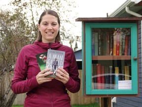 Nicole Wotton, Kenora's little library lady, with some of her favourite books.