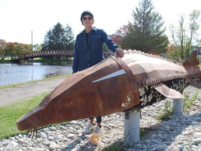 Anishinaabe-kwe artist/sculptor Kathryn Corbiere from M’Chigeeng First Nation stands with the Nookomis Gitche Name' Kwe – grandmother sturgeon – sculpture she created for the Gitche Namewikwedong Reconciliation Garden at Kelso Beach Park in Owen Sound. DENIS LANGLOIS