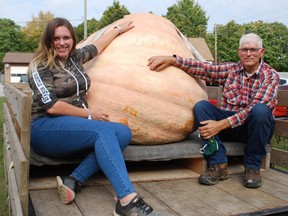 The father-and-daughter duo of Jim and Kelsey Bryson pose with their 1,777.5-pound pumpkin that topped the leaderboard at this year's Port Elgin Pumpkinfest. DENIS LANGLOIS