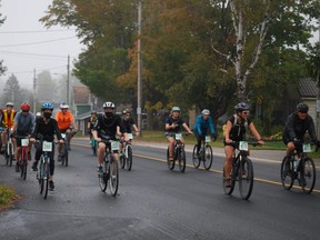 Cyclists head out of Lion's Head on a foggy Sunday morning to begin the Bruce Peninsula Gravel Gran Fondo, which included 35-kilometre, 55-km, 80-km and 115-km routes on the Bruce Peninsula. DENIS LANGLOIS