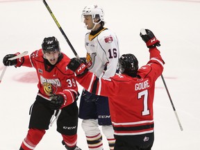 Colts forward Anthony Tabak gets inbetween the celebrations of Colby Barlow and Deni Goure following Goure's second-period marker as the Barrie Colts host the Owen Sound Attack in the Attack's preseason opener Sept. 6, 2021, inside Sadlon Arena in Barrie. Greg Cowan/The Sun Times