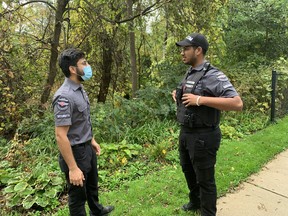 CanCom Security guards Keshav Gubta, left, and Hardik Goyal were protecting a wooded area off Glenwood Drive Friday, where human remains, which were found in August 2020, have been named the first case for the task force investigating the historical deaths of children at the Mohawk Institute.