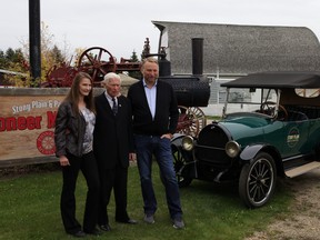 From left to right, Lisa, Gerry, and Gerard Levasseur present a fully-restored 1918 Willys-Overland touring car to the Stony Plain and Parkland Pioneer Museum on Sept. 30, 2021. Photo by Rudy Howell/Postmedia.