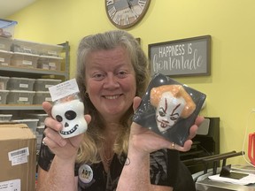 Christine Beale, of Our Natural Creations Goat Milk Soap in Brantford, poses with a couple of her Halloween-inspired bubble bath bombs that she creates in her home studio. Beale was one of more than 40 artists to take part in the Holmedale Art Crawl on Sunday.