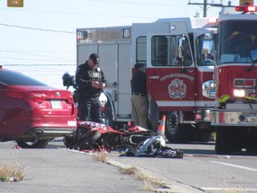 Emergency services respond to a motor vehicle collision involving a car and a motorcycle on Front Road in Kingston on Wednesday.