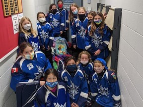 The U12A Ice Breakers gathered nine hockey bags full of winter clothes donations for Hope Mission. Photo supplied.